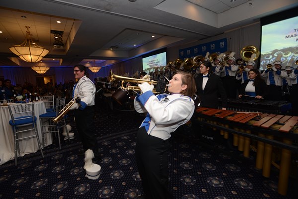The current UMass Lowell Marching Band serenades their predecessors during the band's 40th reunion and the UML Inn & Conference Center.