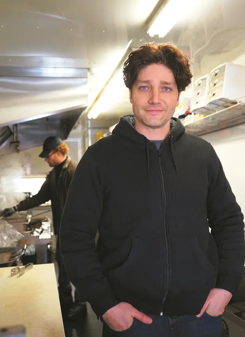 Ben Williams inside the kitchen of his food stand, Marko's Mediterranean Grill in Lowell, Mass.