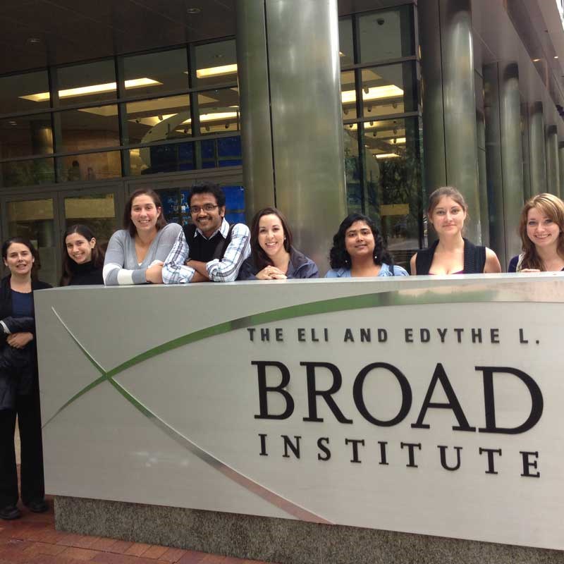 Group of students and faculty gather outside the Broad Institute