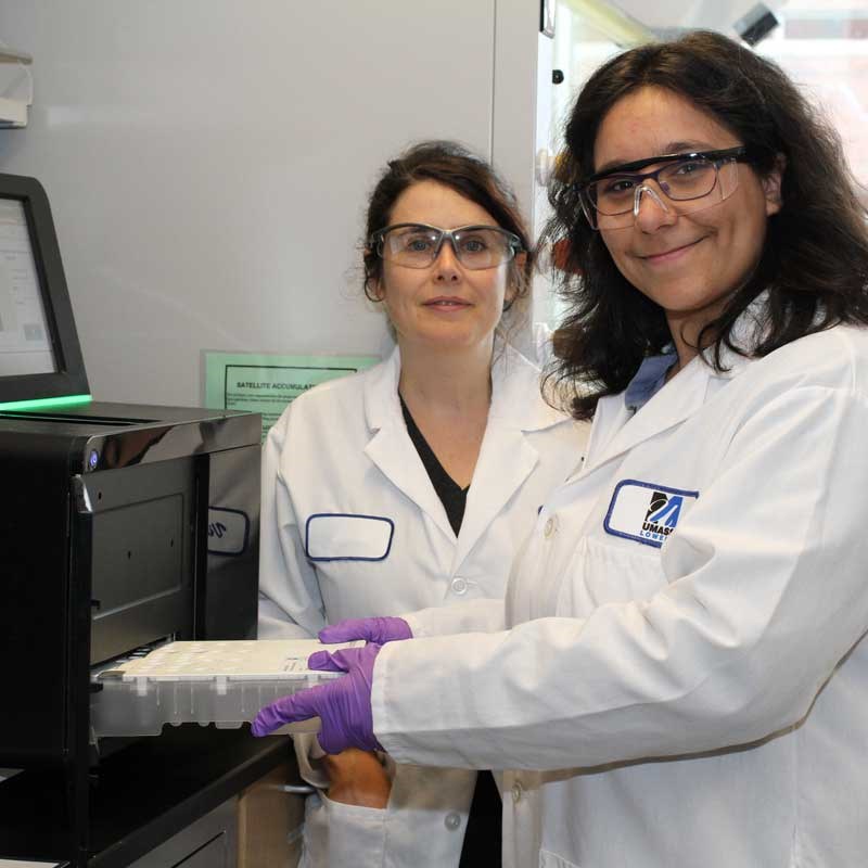 Professor and student in a bioinformatics lab at UMass Lowell 