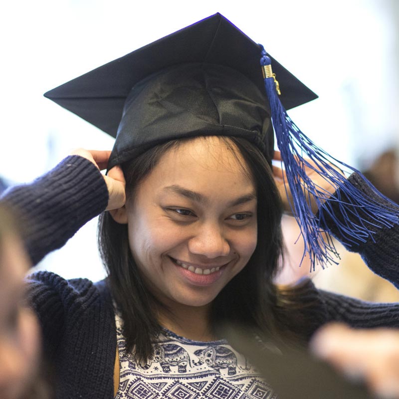 Student tries on mortarboard