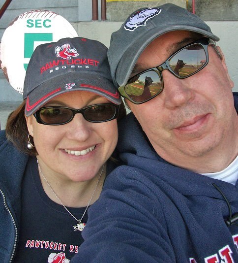 Christine Gillette, Director of Media Relations at UMass Lowell and her husband, John, at a PawSox baseball game