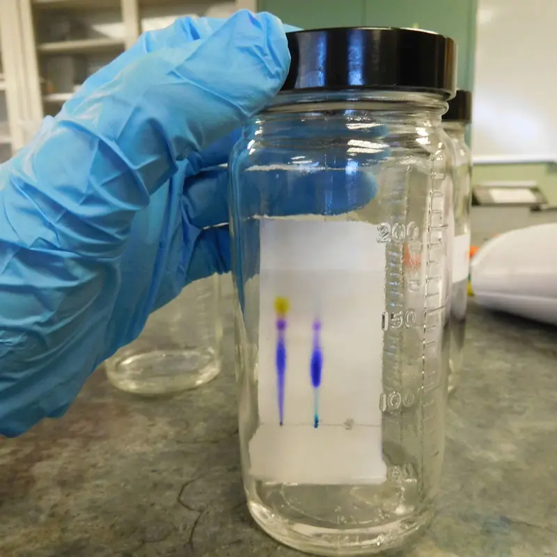 Chemistry samples inside a jar.