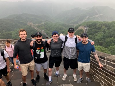 A group of five study abroad students at the Great Wall of China