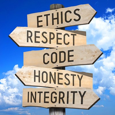 Signpost with ethics, respect, code, honesty and integrity signs on it.