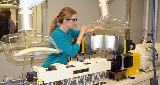 Young woman working in compounding lab