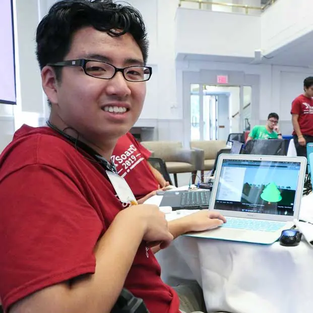 UMass Lowell computer science student displays coding on an open laptop. 