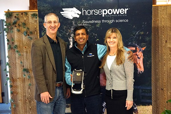 from left, Tom O'Donnell, director of UML's iHub, Mouli Ramani, president and CEO of Horsepower Technologies, and iHub Associate Director Lisa Armstrong, in the entrance to Horsepower Technologies' new office 