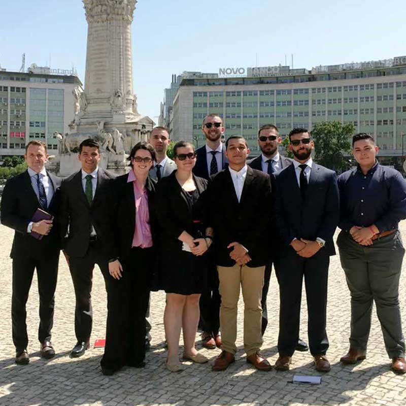 A group of students standing with Neil Shortland outside of the Department of Homeland Security’s P2P: Challenging Extremism competition.