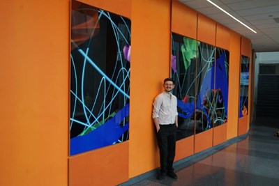 Andrew Fournier '19 returned to campus recently for the dedication of his art piece "River" in the front hallway of the Pulichino Tong Business Center. 
