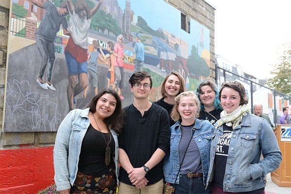 Art and Designs students and alumni painted a mural celebrating the Acre neighborhood, and it is now on display on Decatur WAY