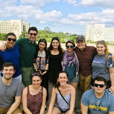 Group picture of students from 2017-2018 UMass Lowell Winter Study Abroad trip to Cuba. This traveling seminar will use the Cuban experience as a backdrop for experiential learning, along with discussions with professionals in that particular field of study, and writing assignments designed to allow students to reflect upon their experience studying and living in Cuba. Students will gain a multi-disciplinary overview of Cuban contemporary culture. and further understanding from a cultural, socio-political and historical context.