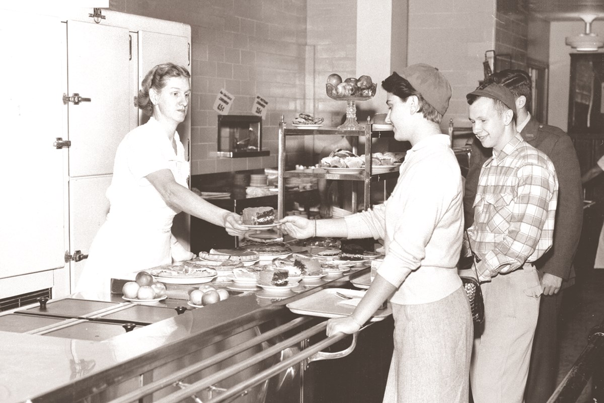 Lowell Technological Institute students line up for cake in the Smith Hall Dining Room sometime in the 1950s