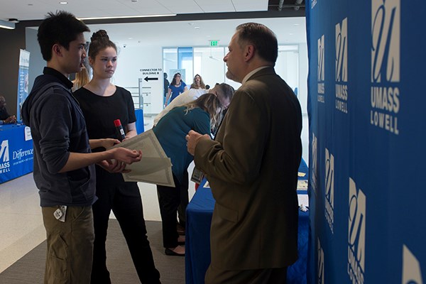 Steven Tello chats with students during a recent DifferenceMaker competition.