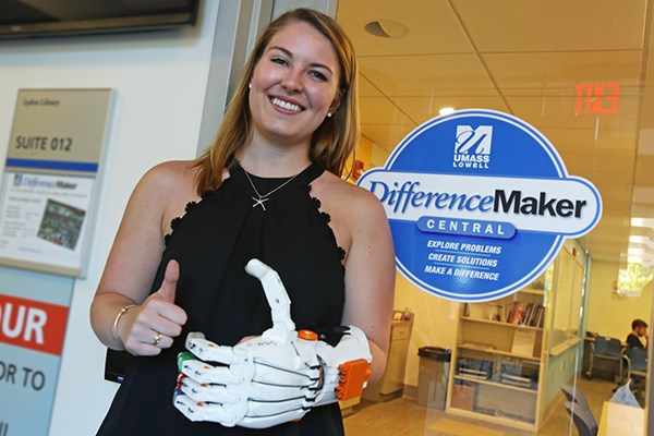 Allison Dunbar '17 (Exercise Physiology); eNABLE Lowell team member poses with prosthetic hand