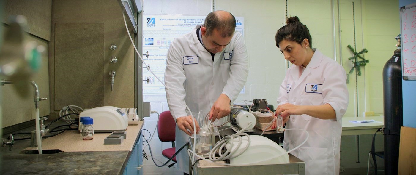 Prof. Ertan Agar and a graduate student work on fuel cell research in the Perry Energy Lab