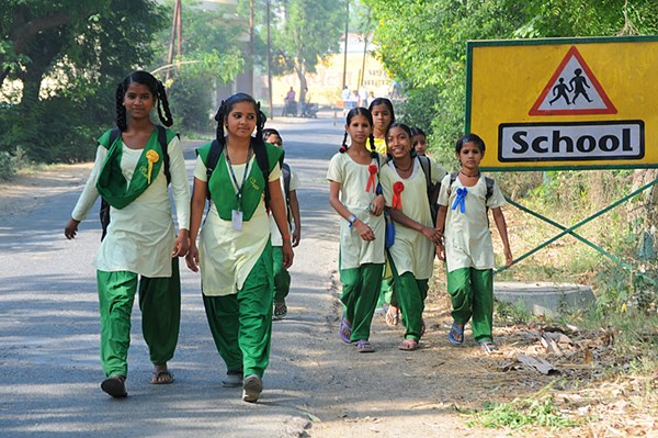 A group walks to Pardada Pardadi, a school for girls in rural India