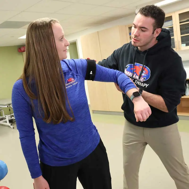 Exercise science students at UMass Lowell practice taking pulse readings