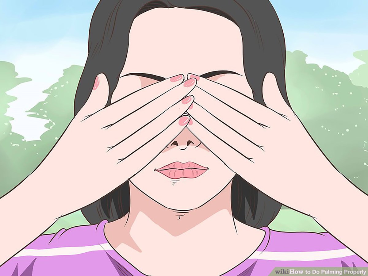 Wiki illustration showing a person demonstrating how to do palming correctly to prevent eye strain.