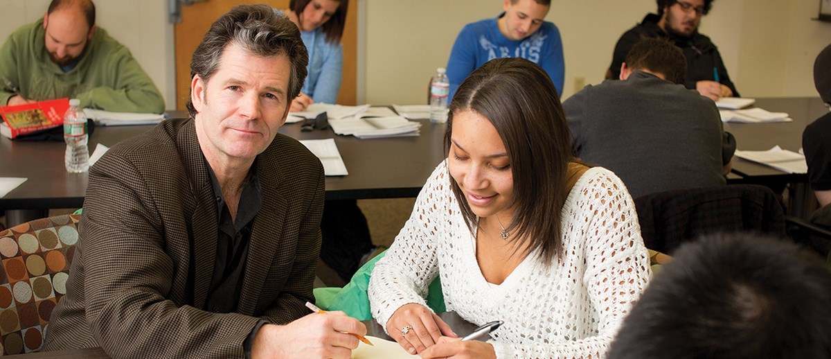 Andre Dubus III poses with a student