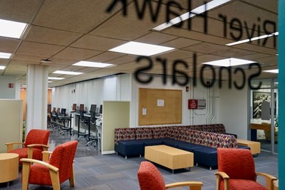 Couches and chairs in the River Hawk Scholars Academy suite at O'Leary Library