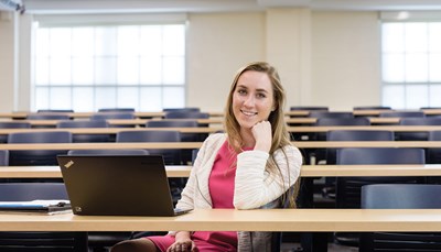 Female graduate student sitting in classroom