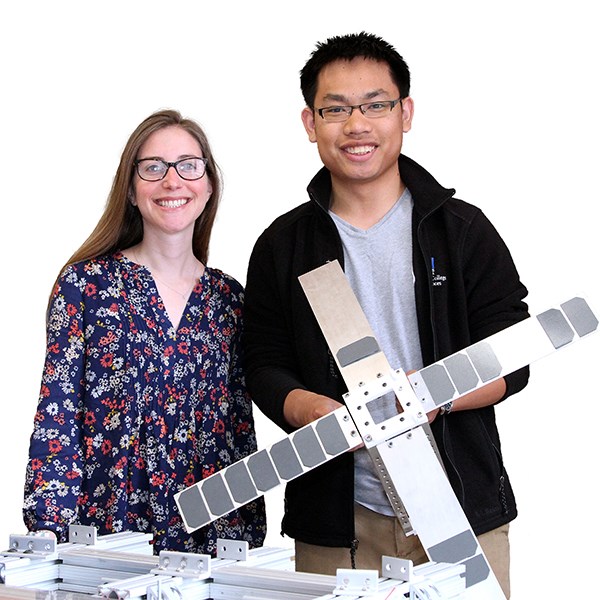 LoCSST Research Scientist Susanna Finn and student Simthyrearch Dy, who holds a scale model of the SPACE HAUC satellite.