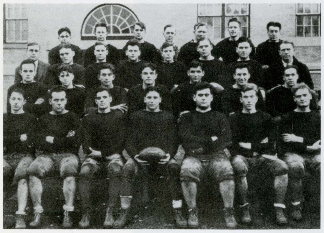 Men's football team poses for a photo, 1928