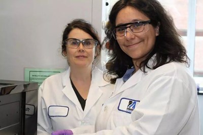 UMass Lowell Professor Jessica Garb, left, in her research lab with Esperanza Rivera de Torre