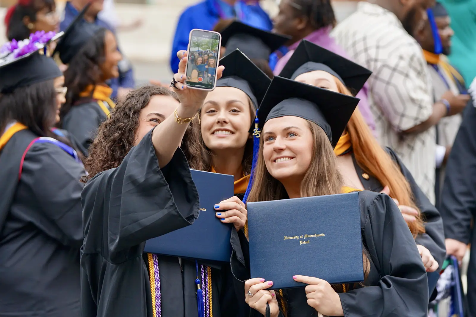 graduates taking selfie