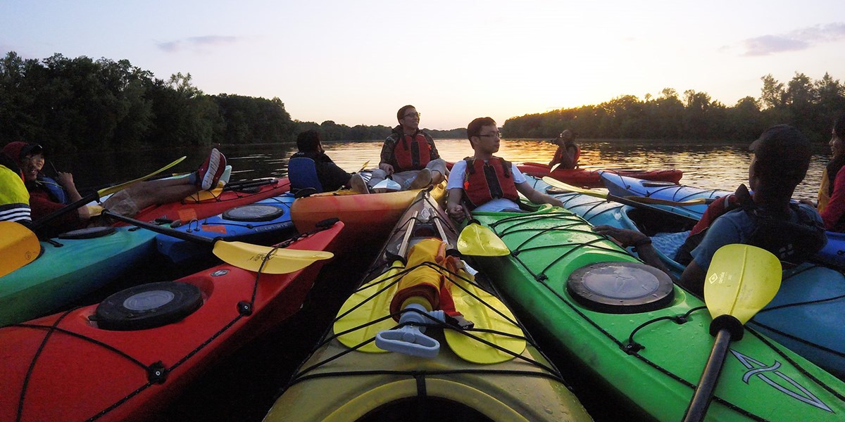 Kayakers Relax at Sunset. At the UMass Lowell Kayak Center you can rent kayaks, canoes, stand-up paddle boards or sign up for kayaking instructional programs, tours and events! 