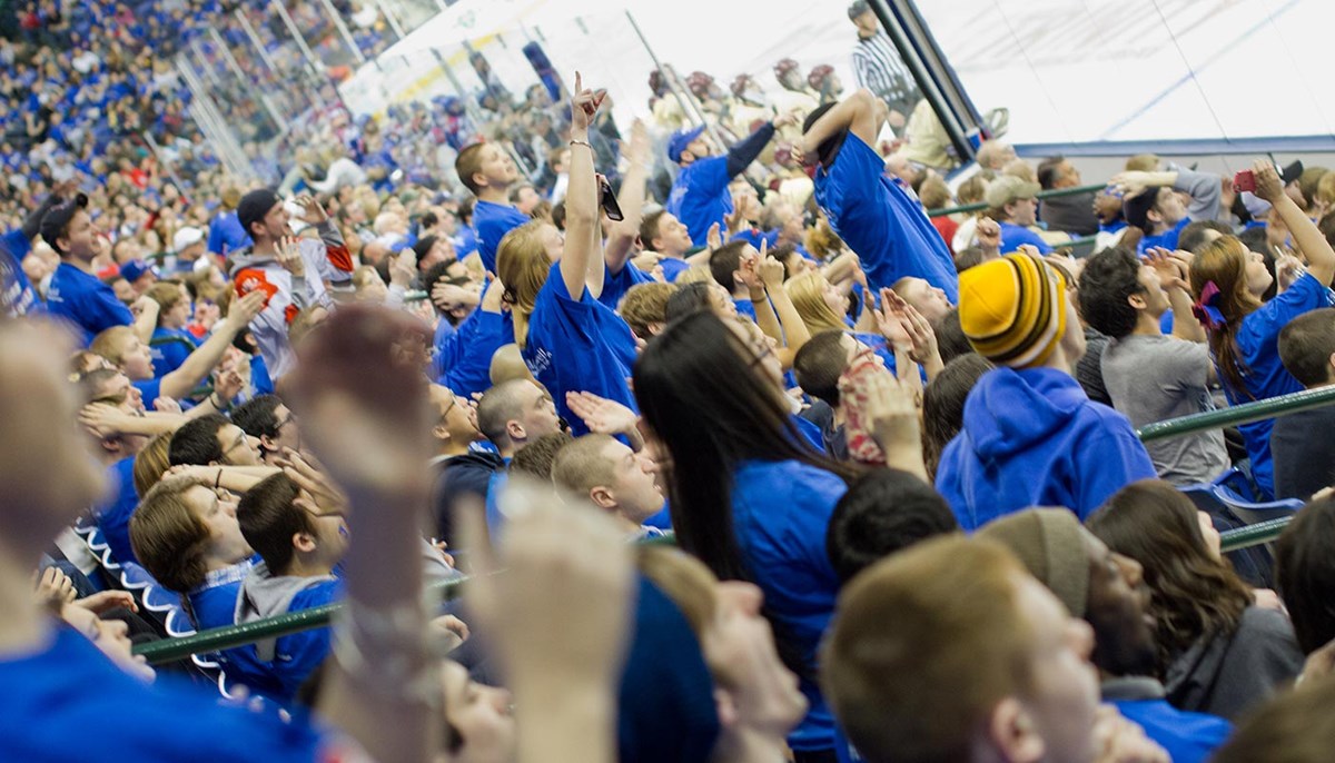Students cheering at hockey game