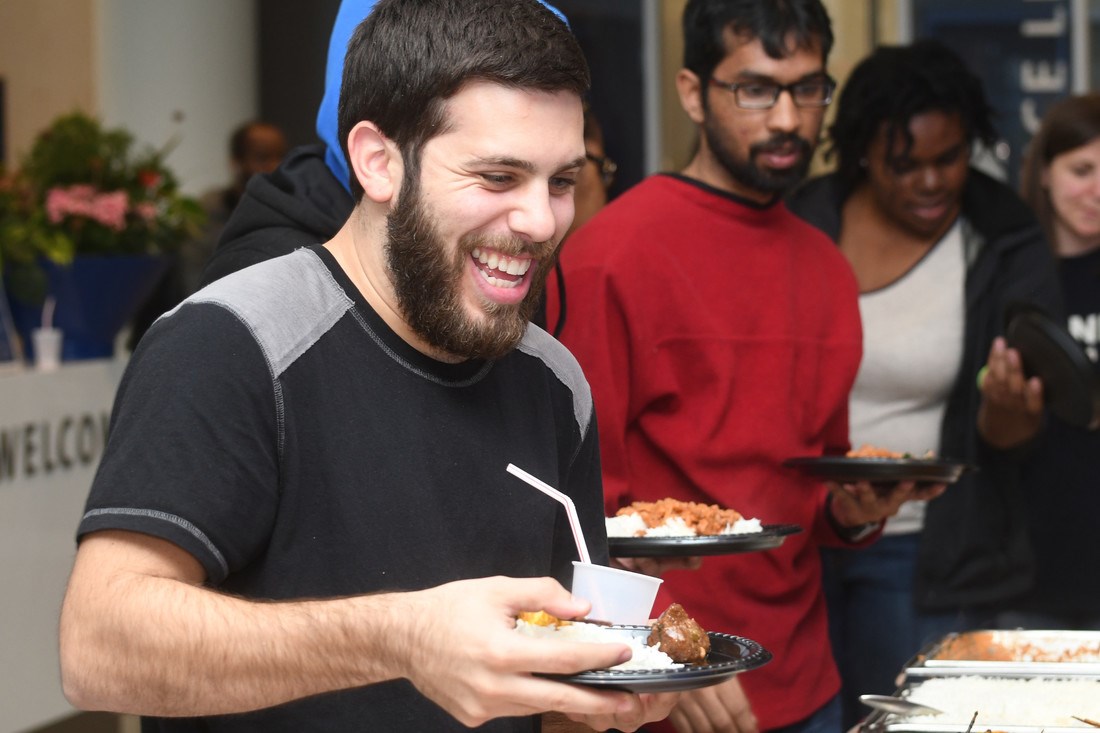 Students grab food at the Cultural Carnivale