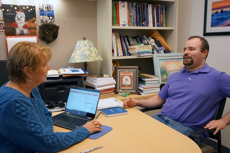 Jared Socolow meets with Associate Teaching Professor Mary Duell in her office.