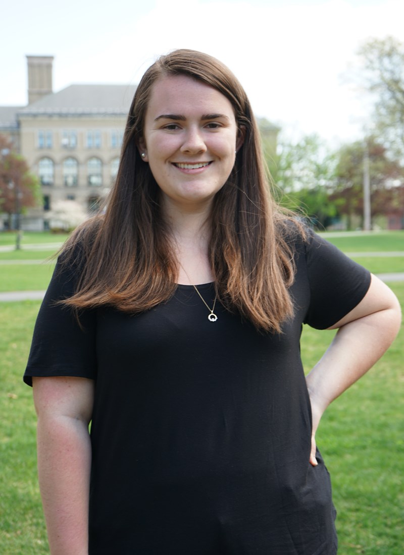 Headshot of Julie Lawton standing outside in front of Coburn Hall