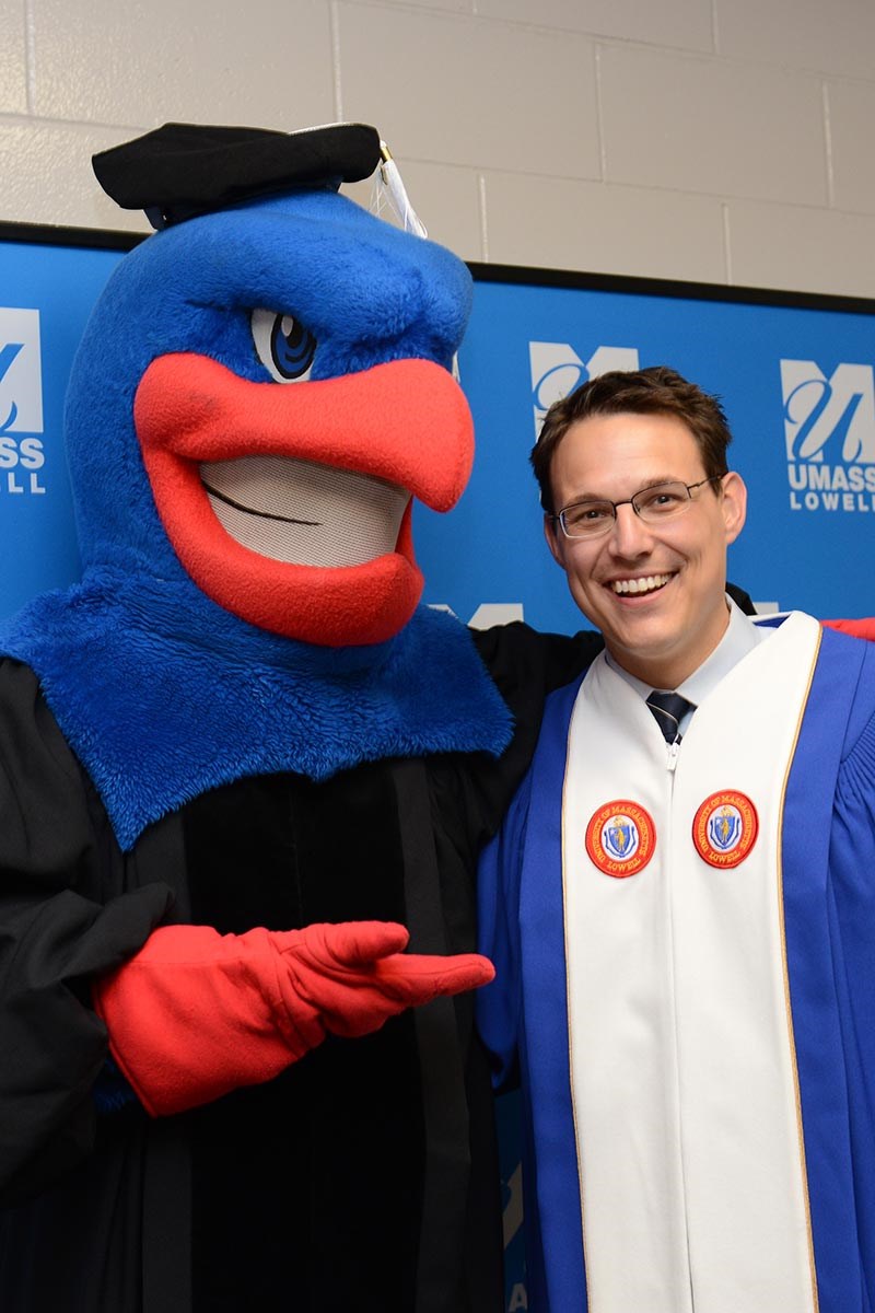 Steve Kornacki and Rowdy the River Hawk before the morning ceremony.