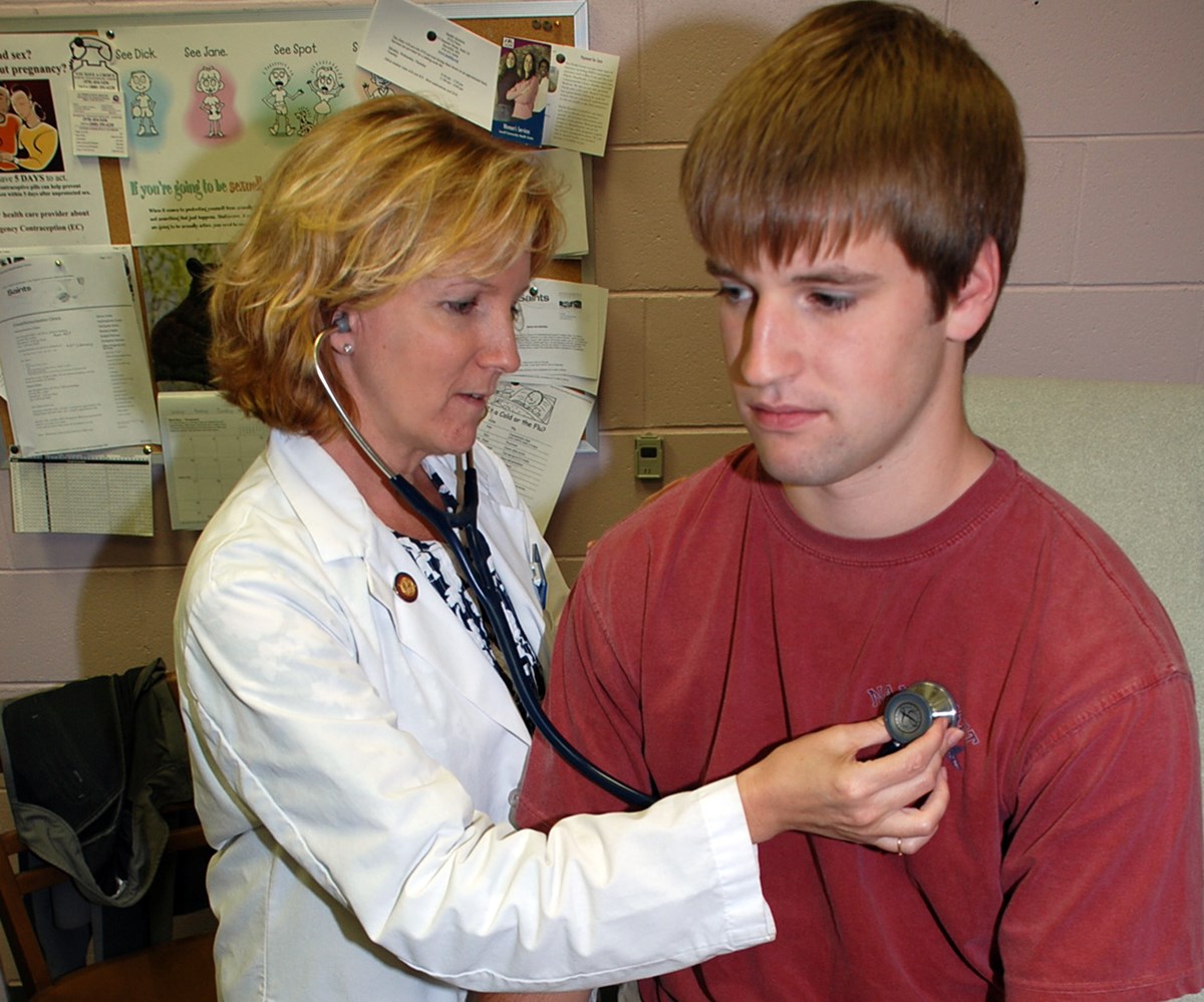 A male student gets his heart beat checked at Student Health Services.