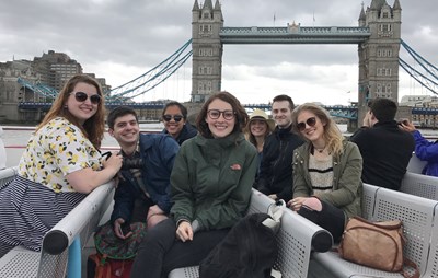 A group of UMass Lowell design students in front of Tower Bridge in London.