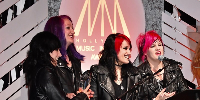 The band members of Flight of Fire onstage at the 2018 Hollywood Music in Media Awards