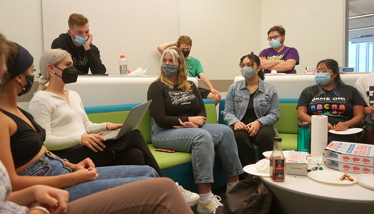 Maddy Roop meets with other masked students in classroom