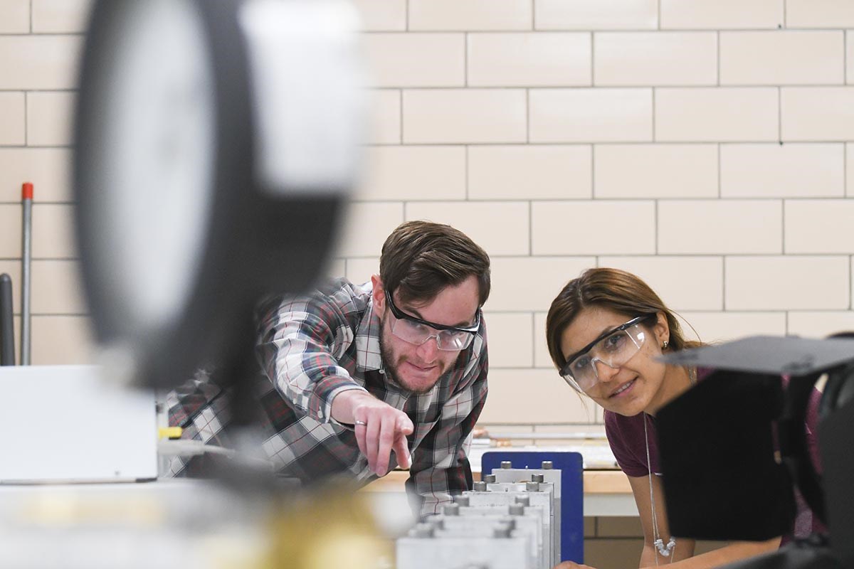  A man and woman in an engineering lab.