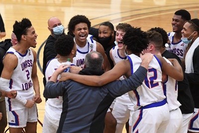 UML basketball players celebrate their first America East playoff win