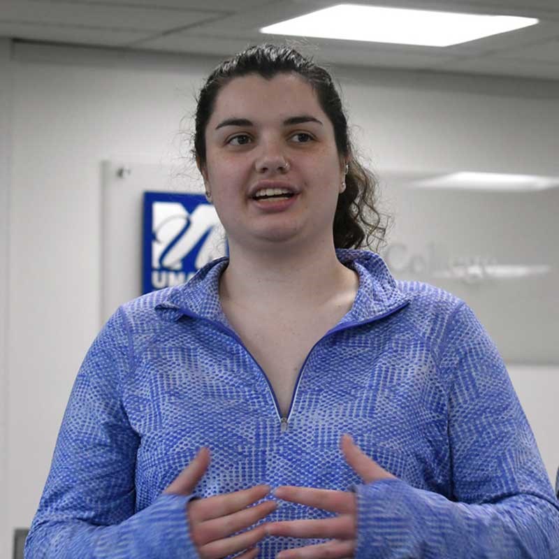 UMass Lowell math student Cora Casteel speaks enthusiastically in the Honors College office