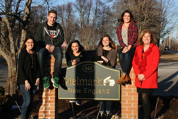 Graphic art students posing outside of Melmark school in Andover