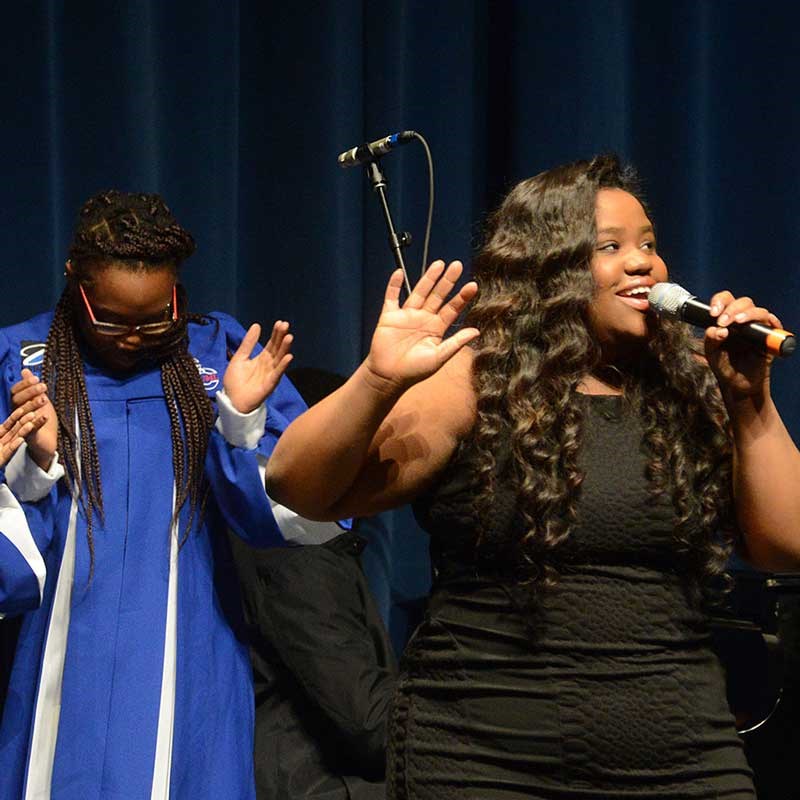 Two students from the UMass Lowell Gospel Choir performing.