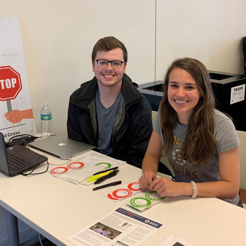 Nicholas Shepherd and Alexandra McKinney at the registration table of a blood drive hosted by the Students for Interprofessional Education Club