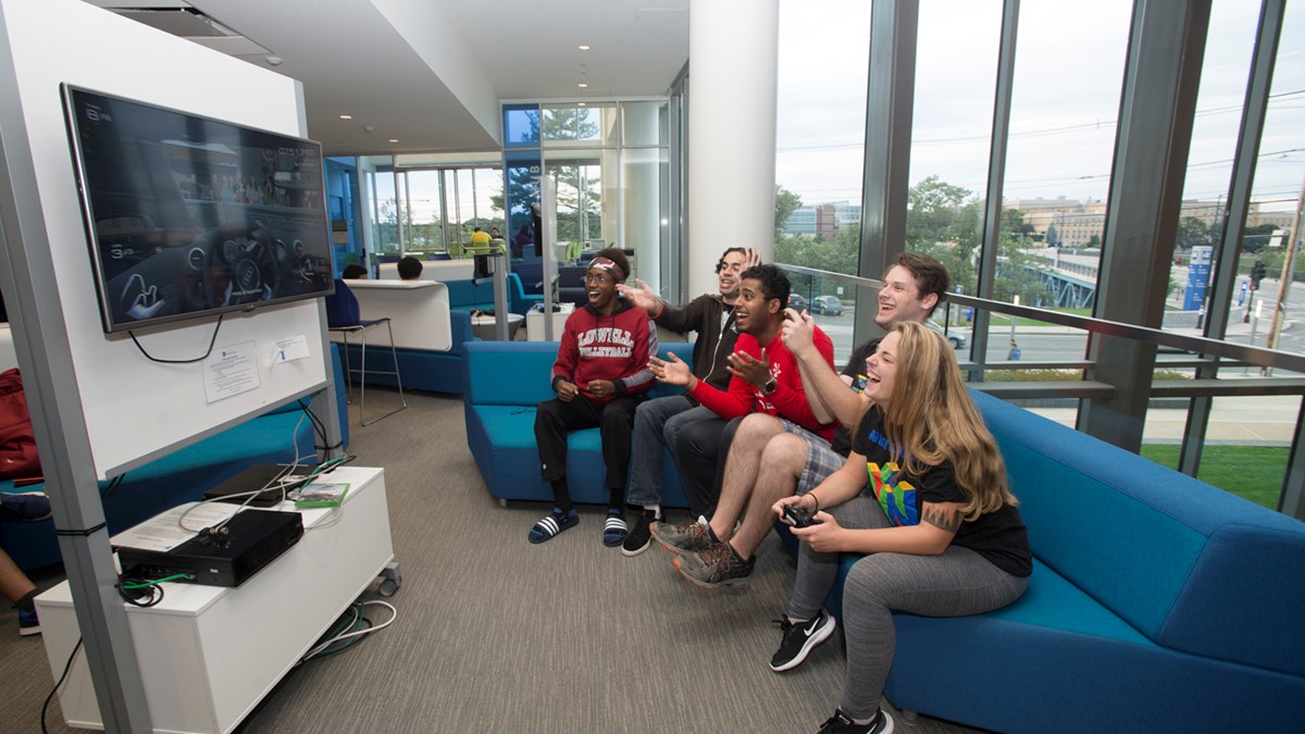 Members of UML's Super Smash Bros. Club gather on the second-floor Club Hub at University Crossing to play the racing game Forza Motorsport 6