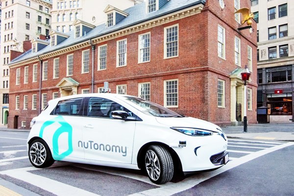A photo of a nuTonomy car on the road in Boston's Seaport district