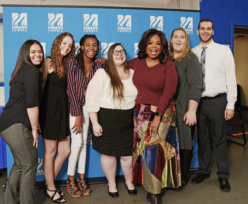 Oprah Winfrey poses with the first six UMass Lowell Oprah Winfrey Scholarship winners