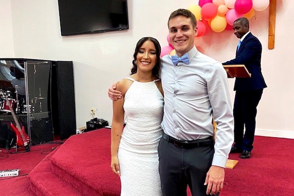 Nazeli Acosta and Jorge Morales pose for a photo after their wedding ceremony